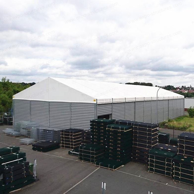 Tienda de almacenamiento de almacén Industrial grande, PVC a prueba de rayos UV, impermeable, sándwich ignífugo, hojas de acero duraderas, logotipo de tela para uso en exteriores